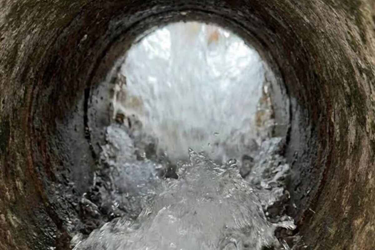 Water blasting through a large drain line during jetting