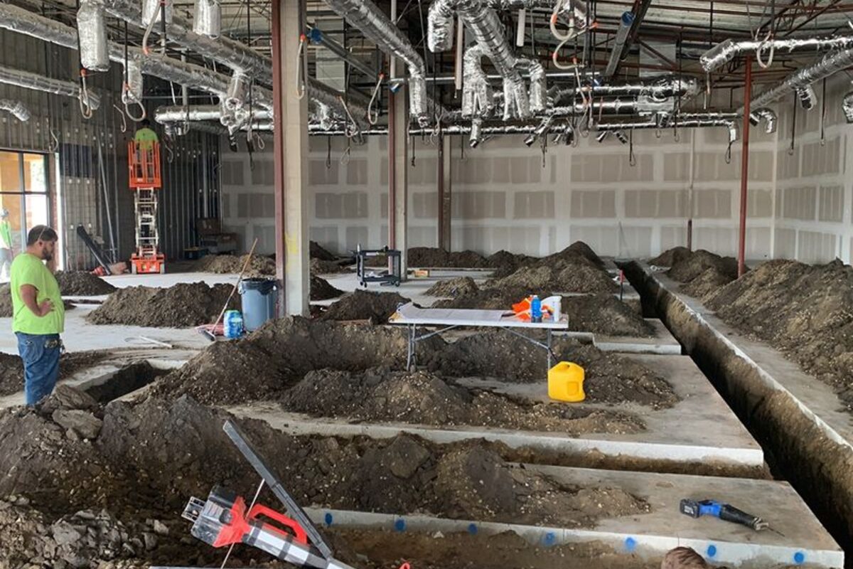 Underground plumbing rough-in at a new construction site