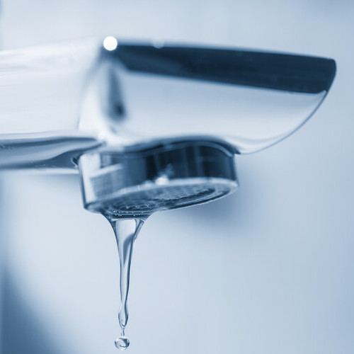 close-up of a leaking faucet