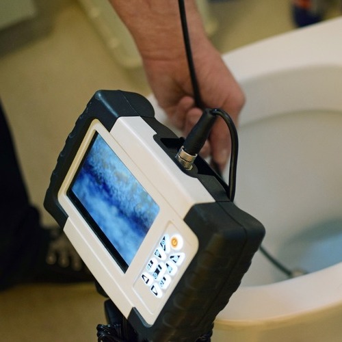 plumber using a camera to perform an inspection
