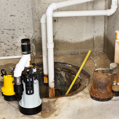 Replacing the old sump pump in a basement with a new one to drain the collected ground water